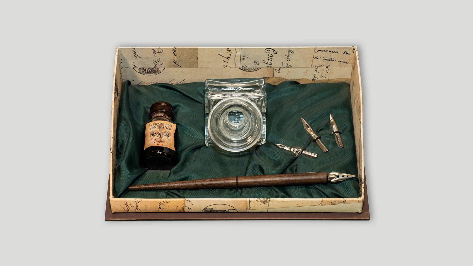 Box with inkwell, quill, ink and three nibs
